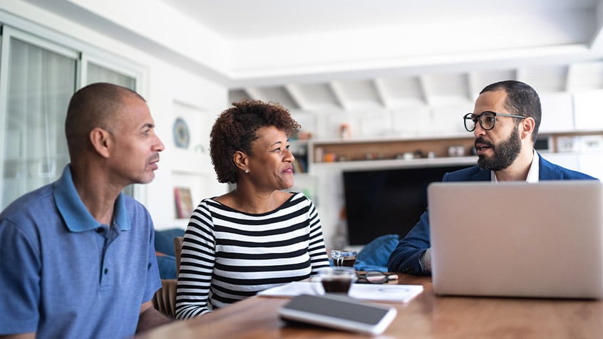 older couple talking with advisor