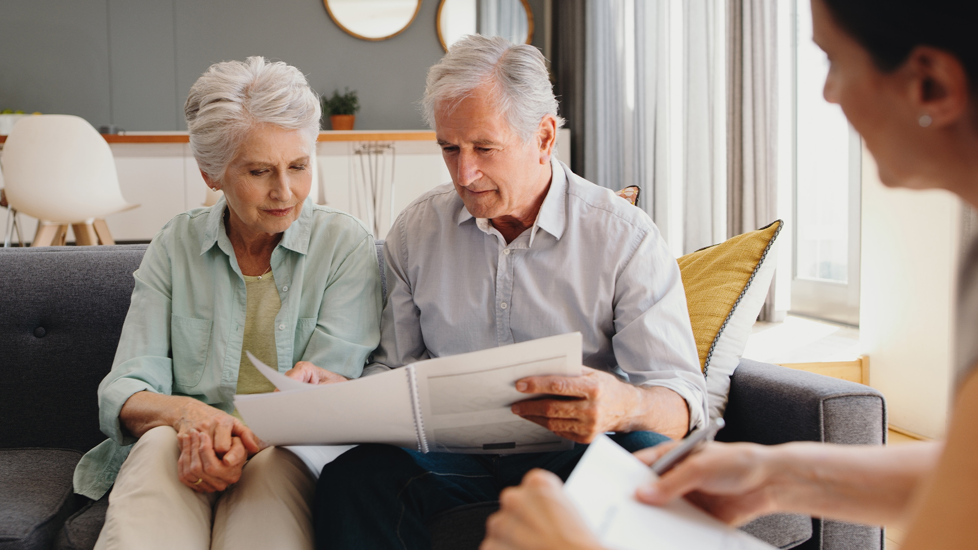 older couple looking at a presentation