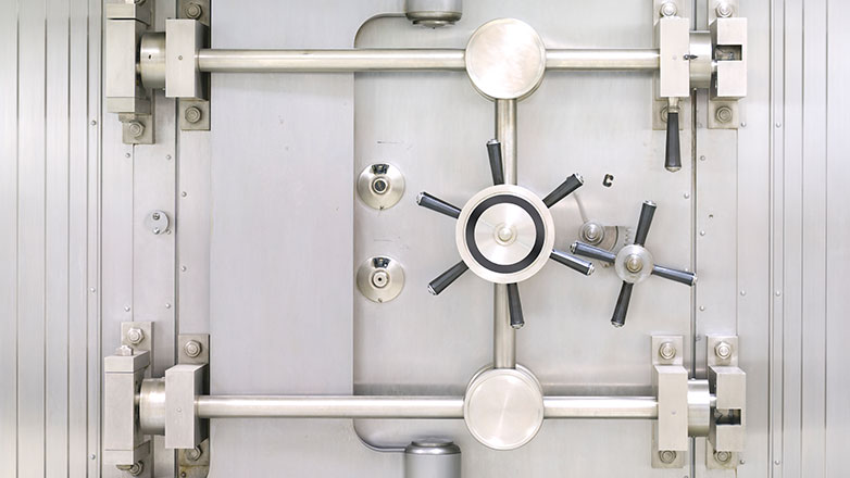 Large vault door with silver finish.