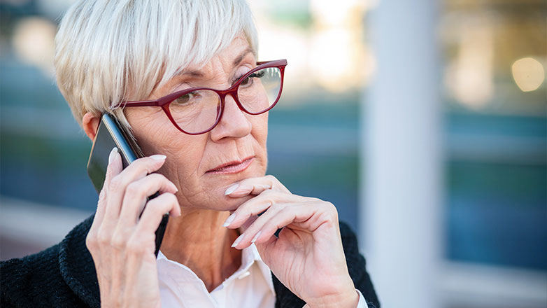 close up of woman on serious phone call