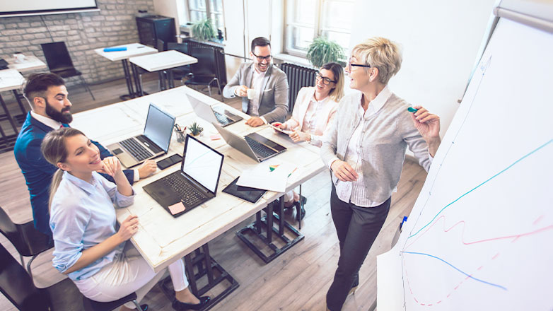 woman giving presentation to employees