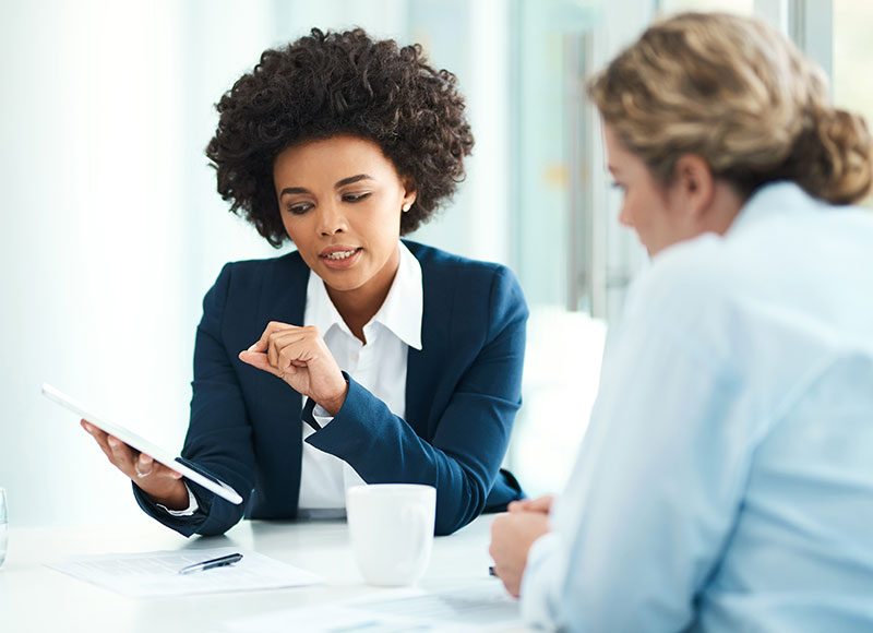 advisor showing client something on a tablet