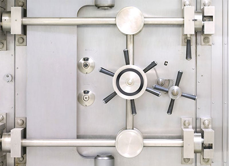 Large vault door with silver finish.